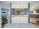 Bright and airy kitchen area with ample cabinet space, countertop seating, and an open layout, perfect for modern living at 1156 Capella Dr, Tavares, FL 32778