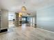 Spacious, open-concept living room with updated kitchen and attractive flooring at 1156 Capella Dr, Tavares, FL 32778