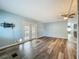 Bright living room with french doors and attractive flooring at 1156 Capella Dr, Tavares, FL 32778