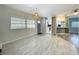 Open-concept living area with great natural light and a view of the adjacent kitchen at 1156 Capella Dr, Tavares, FL 32778