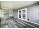 Sunroom featuring wood-look flooring, accent lighting, and multiple windows at 1156 Capella Dr, Tavares, FL 32778