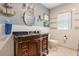 Bathroom featuring granite countertop vanity and unique nautical decor at 11750 Watts Ct, Tavares, FL 32778