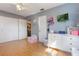 Bedroom featuring two closets, dresser, and mounted TV at 11750 Watts Ct, Tavares, FL 32778