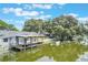 The waterfront includes a covered dock and scenic views of the water and surrounding trees at 11750 Watts Ct, Tavares, FL 32778