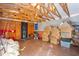 The garage has exposed ceiling beams, concrete floors and ample space for storage at 11750 Watts Ct, Tavares, FL 32778