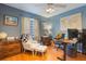 Well-lit home office with hardwood floors and dedicated workspace at 11750 Watts Ct, Tavares, FL 32778