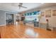 Cozy living room showcasing hardwood floors, a ceiling fan, and backyard views at 11750 Watts Ct, Tavares, FL 32778