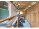 This storage space has ample room for various items, featuring wooden beams and natural light at 11750 Watts Ct, Tavares, FL 32778
