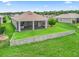 Aerial view of the backyard featuring mature landscaping, and screened-in lanai at 12198 Se 176Th Loop, Summerfield, FL 34491