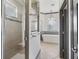 Elegant bathroom showcasing a glass shower and freestanding tub with chandelier at 12198 Se 176Th Loop, Summerfield, FL 34491