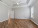 Large bedroom boasts tray ceiling, bright window, wood flooring, and entry to the bathroom at 12198 Se 176Th Loop, Summerfield, FL 34491