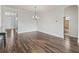 Bright dining room with wood-look tile flooring and elegant chandelier at 12198 Se 176Th Loop, Summerfield, FL 34491