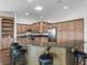 Kitchen island with granite countertop and barstool seating, stainless appliances at 12198 Se 176Th Loop, Summerfield, FL 34491