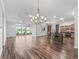 Spacious living area with backyard view and an open kitchen island at 12198 Se 176Th Loop, Summerfield, FL 34491