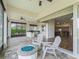 Screened patio with outdoor seating, grilling area, and golf course views at 12198 Se 176Th Loop, Summerfield, FL 34491