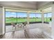 Screened patio overlooking the golf course with outdoor seating and great views at 12198 Se 176Th Loop, Summerfield, FL 34491