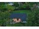 Beautiful aerial view of a home featuring a dark roof, spacious backyard, and manicured landscaping at 1237 Mercedes Pl, Orlando, FL 32804