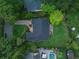 Aerial view of a home with a dark roof, a large backyard, and an outdoor seating area at 1237 Mercedes Pl, Orlando, FL 32804