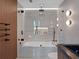 Luxurious bathroom showcasing a glass enclosed shower, soaking tub, and stylish fixtures at 1237 Mercedes Pl, Orlando, FL 32804