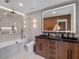 Modern bathroom with double sink vanity, soaking tub, and glass-enclosed shower at 1237 Mercedes Pl, Orlando, FL 32804