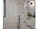 Elegant bathroom featuring marble-style tile, modern fixtures, and a glass-enclosed shower at 1237 Mercedes Pl, Orlando, FL 32804