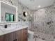 Stylish bathroom with marble accents, glass shower, and floating vanity at 1237 Mercedes Pl, Orlando, FL 32804