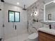 Elegant bathroom with marble tiling, glass shower, and sleek modern vanity at 1237 Mercedes Pl, Orlando, FL 32804