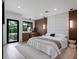 Stylish bedroom with wood paneled wall and bright lighting at 1237 Mercedes Pl, Orlando, FL 32804