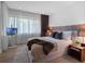 Serene bedroom with plush bedding, TV, and soft natural lighting at 1237 Mercedes Pl, Orlando, FL 32804