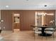 Dining room with custom wall paneling and wine storage at 1237 Mercedes Pl, Orlando, FL 32804