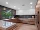 Beautiful modern kitchen with sleek cabinetry and backyard view at 1237 Mercedes Pl, Orlando, FL 32804