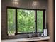 Features a modern sink and window with lush greenery views at 1237 Mercedes Pl, Orlando, FL 32804