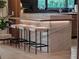 Kitchen island with marble accents and modern seating at 1237 Mercedes Pl, Orlando, FL 32804