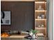 Modern living room with a fireplace, built-in shelving, and artful décor at 1237 Mercedes Pl, Orlando, FL 32804