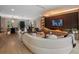 Open-concept living room with a fireplace, sleek furniture, and dining area at 1237 Mercedes Pl, Orlando, FL 32804