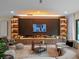 Modern living room featuring a fireplace, built-in shelving, sleek furniture, and lots of light at 1237 Mercedes Pl, Orlando, FL 32804