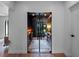 Office showcases glass doors, hardwood floors, custom desk with built-in shelving at 1237 Mercedes Pl, Orlando, FL 32804
