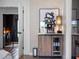 Cozy wet bar area with wine fridge, coffee machine, and modern art at 1237 Mercedes Pl, Orlando, FL 32804