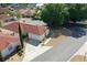 Aerial view of a well-maintained home with a red roof in a peaceful neighborhood at 1325 Balboa Ct, The Villages, FL 32159