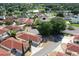 Community aerial view showcasing single-Gathering homes with mature trees and well-kept landscaping at 1325 Balboa Ct, The Villages, FL 32159