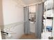 Well-organized closet with shelving and ample storage, enhanced with gray curtains at 1325 Balboa Ct, The Villages, FL 32159