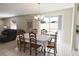 Dining area featuring a table for six and sliding doors opening to an outdoor patio space at 1325 Balboa Ct, The Villages, FL 32159