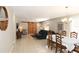 Bright living room featuring a dining area, sliding barn doors, comfortable furniture, and neutral walls at 1325 Balboa Ct, The Villages, FL 32159