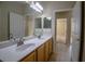 Bathroom with double sinks and tile floor at 1355 Misty Glen Ln, Clermont, FL 34711