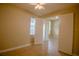 Cozy bedroom features tile flooring, neutral walls, and ample natural light, providing a blank slate for personalization at 1355 Misty Glen Ln, Clermont, FL 34711