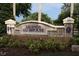 Beautiful stone sign for Legends Clubhouse, complemented by lush greenery and manicured landscaping at 1355 Misty Glen Ln, Clermont, FL 34711