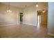 Inviting living room with tile floors, neutral walls, and arched entryways, creating a comfortable and open atmosphere at 1355 Misty Glen Ln, Clermont, FL 34711