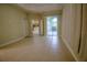 Open living space with tile flooring and sliding doors leading to the outdoor area at 1355 Misty Glen Ln, Clermont, FL 34711