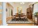Dining room with hardwood floors, decorative rug, and space for dinner gatherings at 1426 Lakemist Ln, Clermont, FL 34711