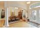 Grand foyer boasts high ceilings, a decorative glass front door, and views of the formal dining area at 1426 Lakemist Ln, Clermont, FL 34711
